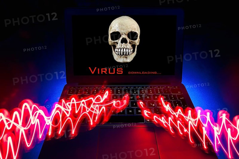 Laptop with skull and crossbones on screen