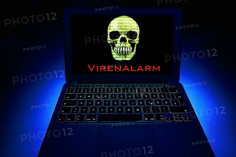 Laptop with skull and crossbones on screen