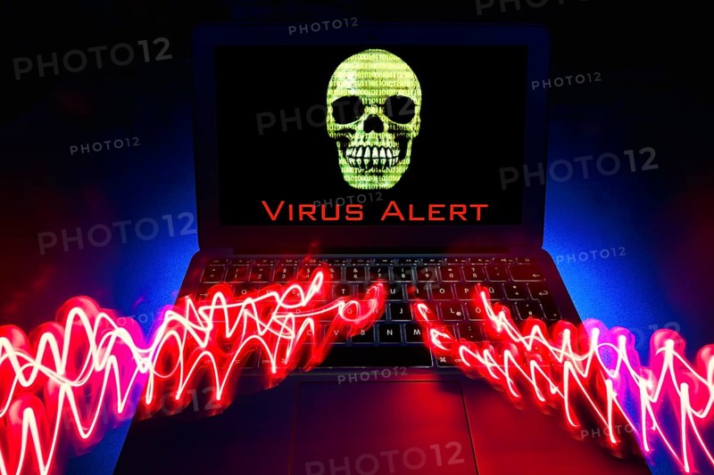 Laptop with skull and crossbones on screen