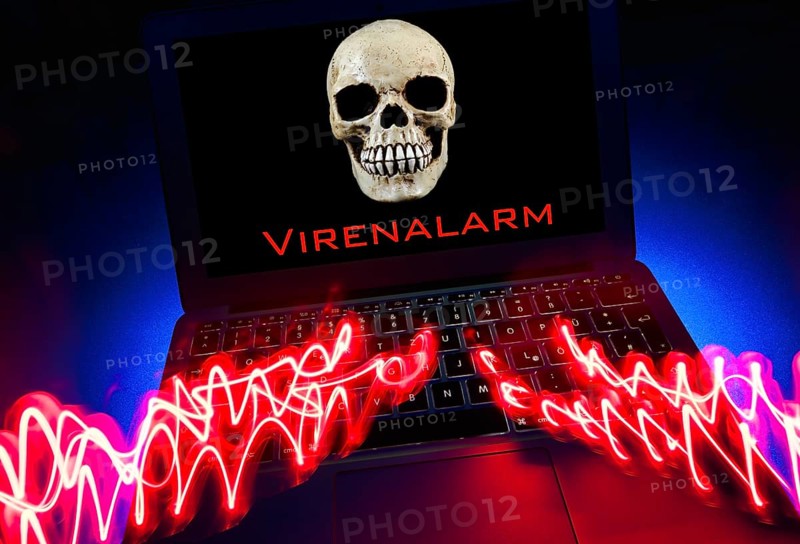 Laptop with skull and crossbones on screen