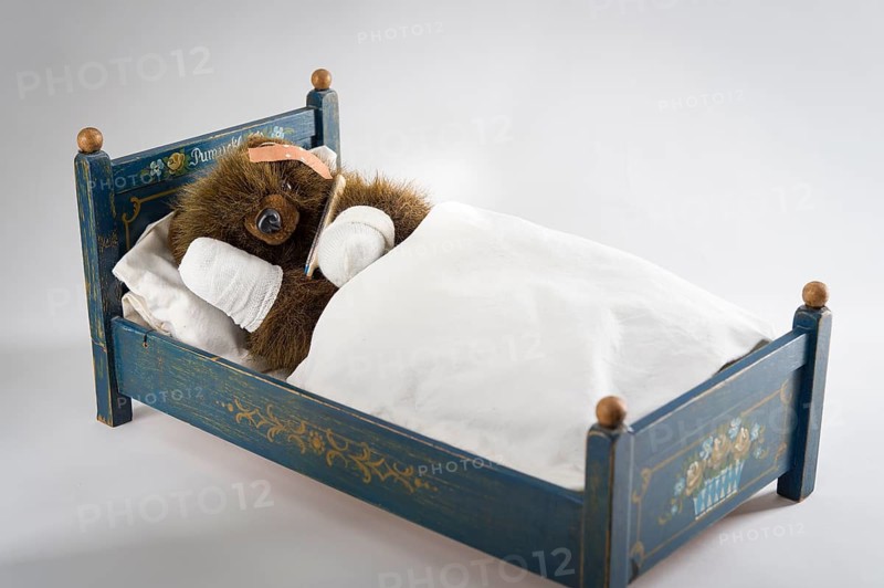 Sick Teddy Bear with head and paws bandaged
