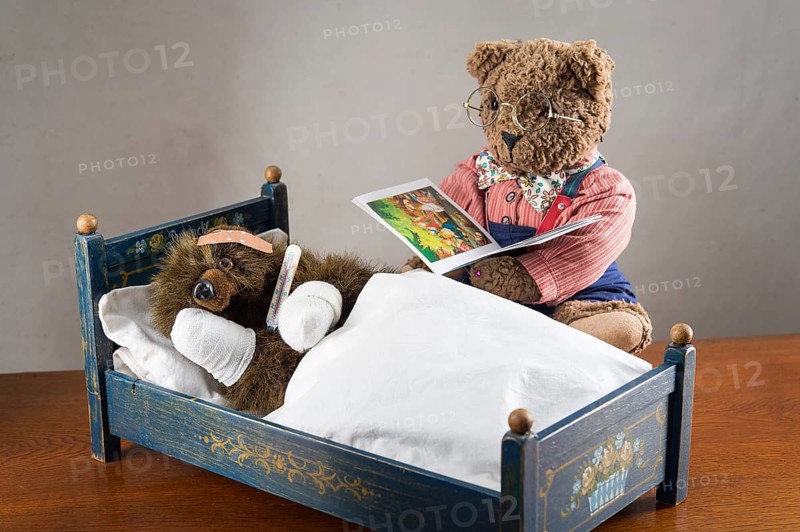 Sick Teddy Bear with bandaged paws and head