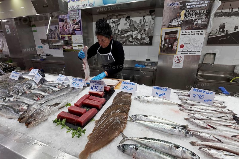 Fish stall saleswoman