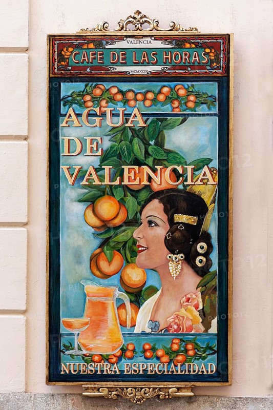 Advertising board for the cocktail Agua de Valencia at a cafe