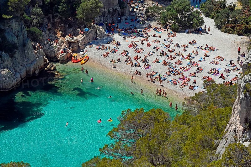 Tourists at beach with turquoise water