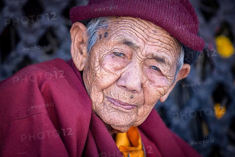 Elderly female Buddhist nun at Boudhanath stupa