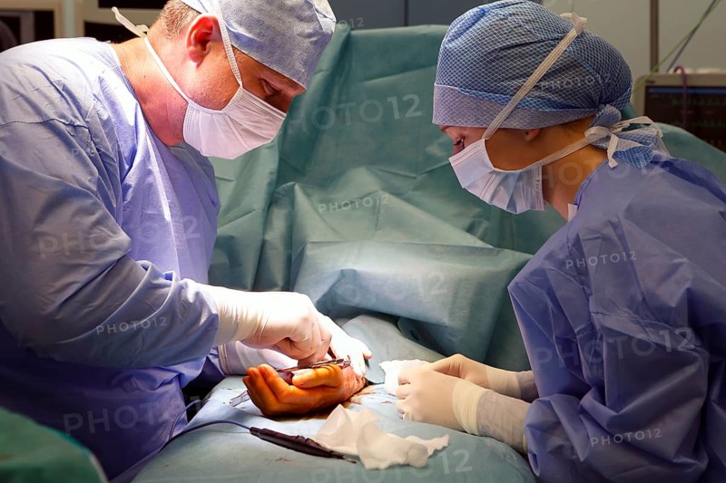 Surgeons during surgery in the operating theatre