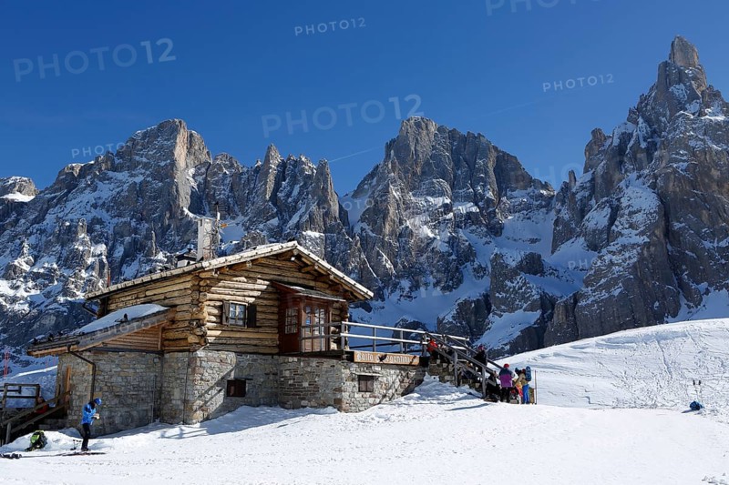 Hikers at mountain hut in the snow