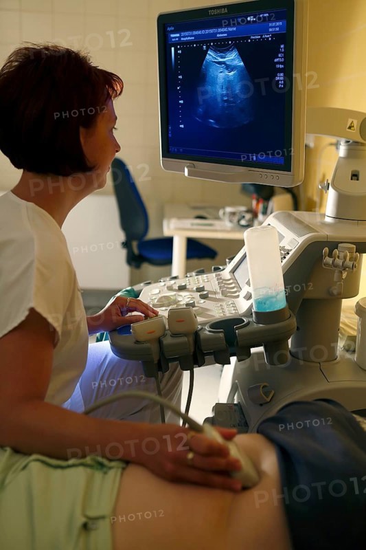 Nurse at the monitor with patient at ultrasound