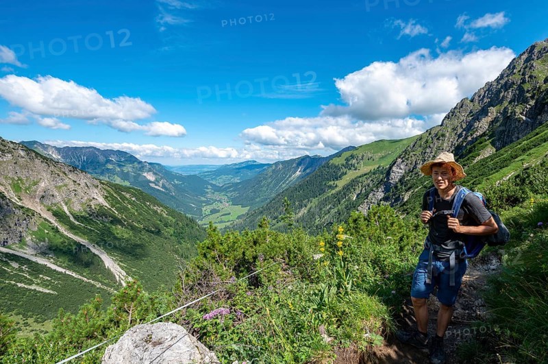 Hiker on the hiking trail from Hinterstein to Schrecksee