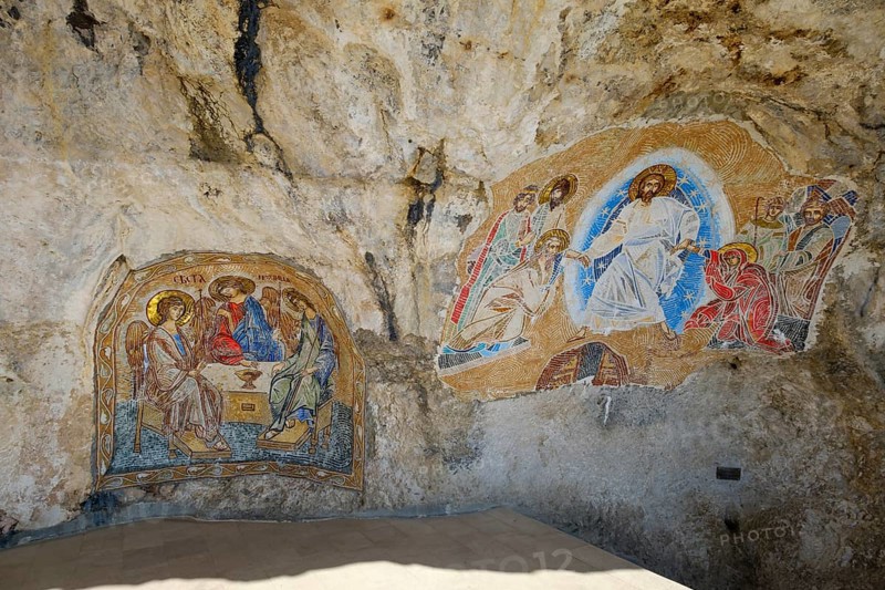 Religious mosaics on rock face