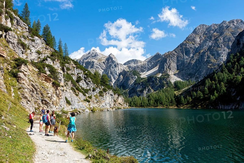 Hikers at the mountain lake