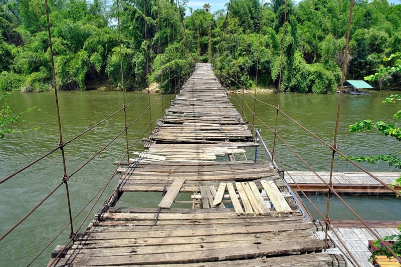 Dilapidated suspension bridge over River Kwai