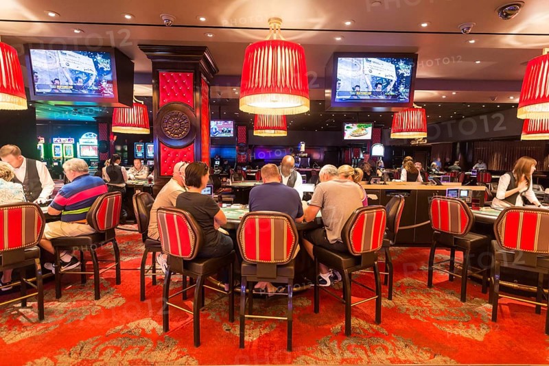 Poker players at poker table in casino