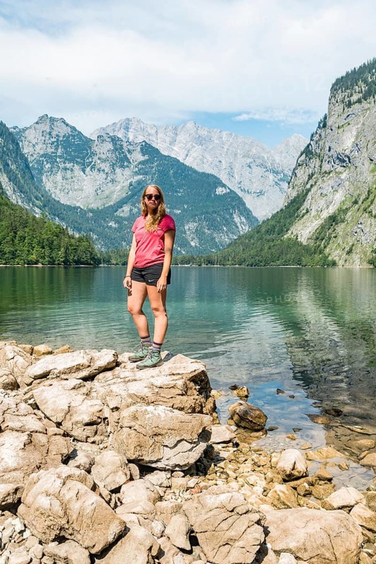 Hiker stands on the shore of the Obersee