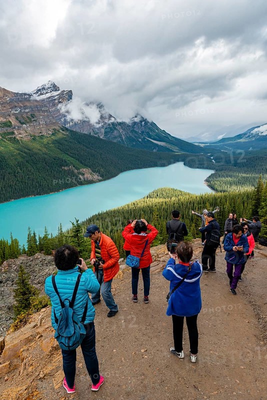 Asian tourists pose for a photo