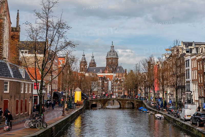 View from a bridge at Oudezijds Voorburgwal to the canal and the Sint Nicolaaskerk