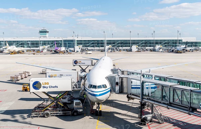 Passenger aircraft with docked passenger boarding bridge