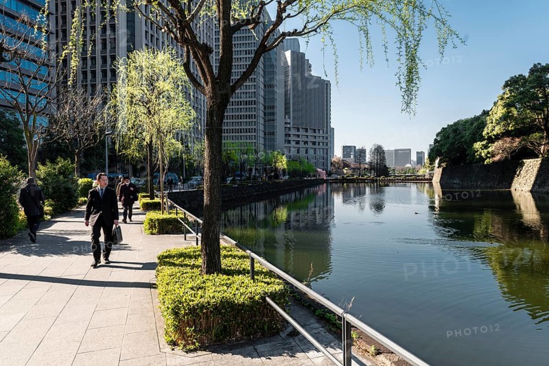 Promenade with pedestrians at the castle moat