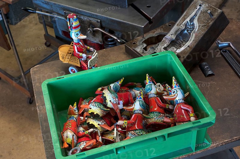assembly box with tin toys of the 1950s
