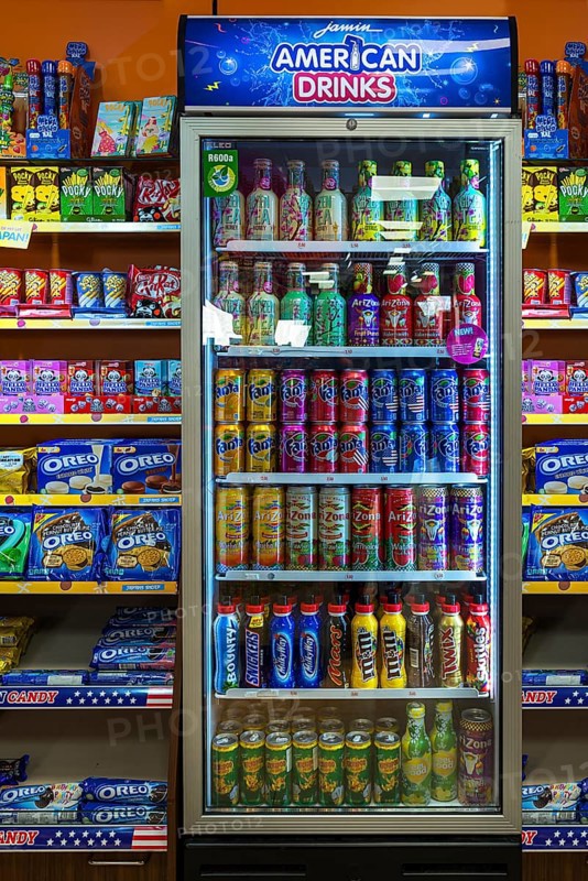 Beverage cans in a refrigerator in a grocery store