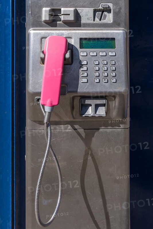 Public pay phone with pink handset
