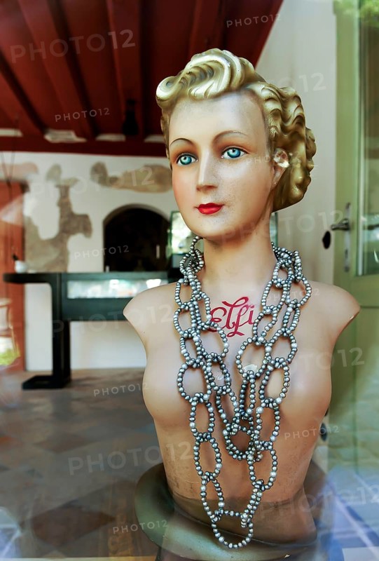 Old mannequin of the 20s with necklace