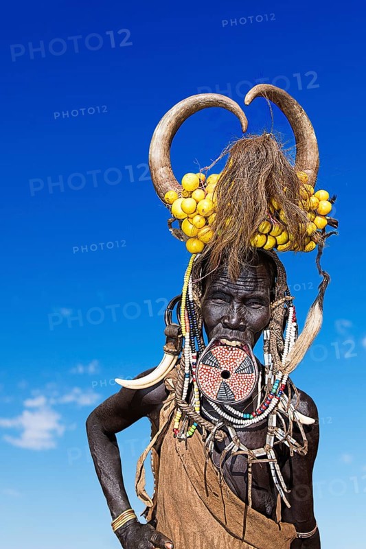 Woman with large lip plate and horns
