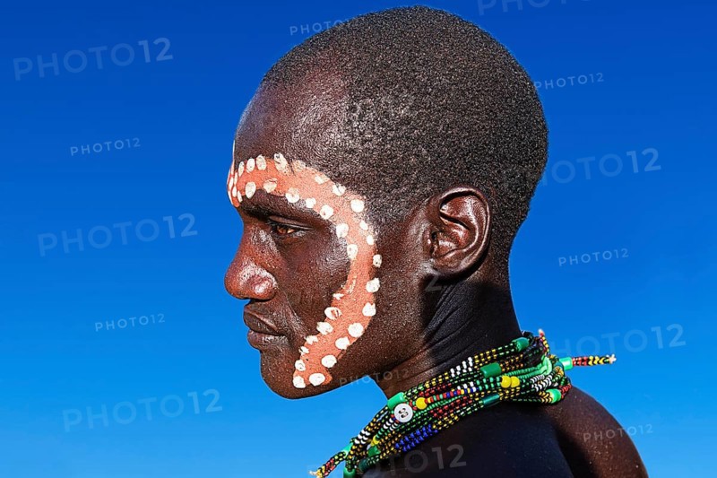 Man with ritual face painting for the cattle jump ritual