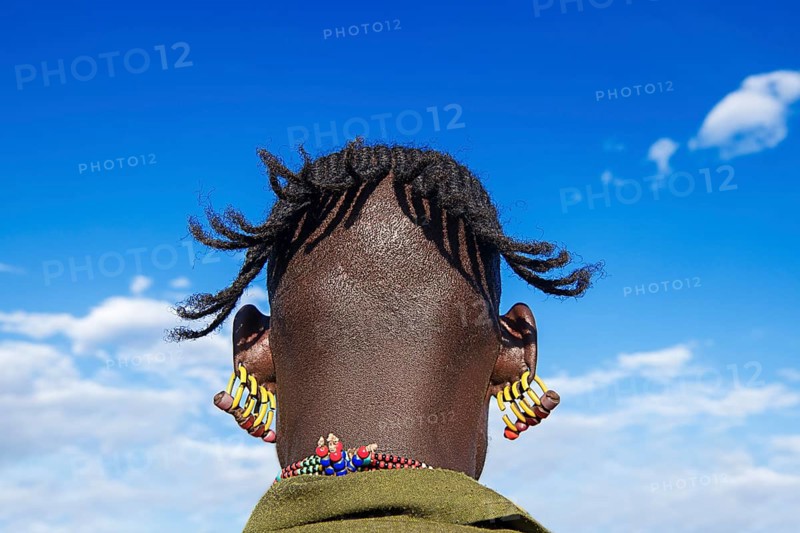 Man with four earrings in each ear
