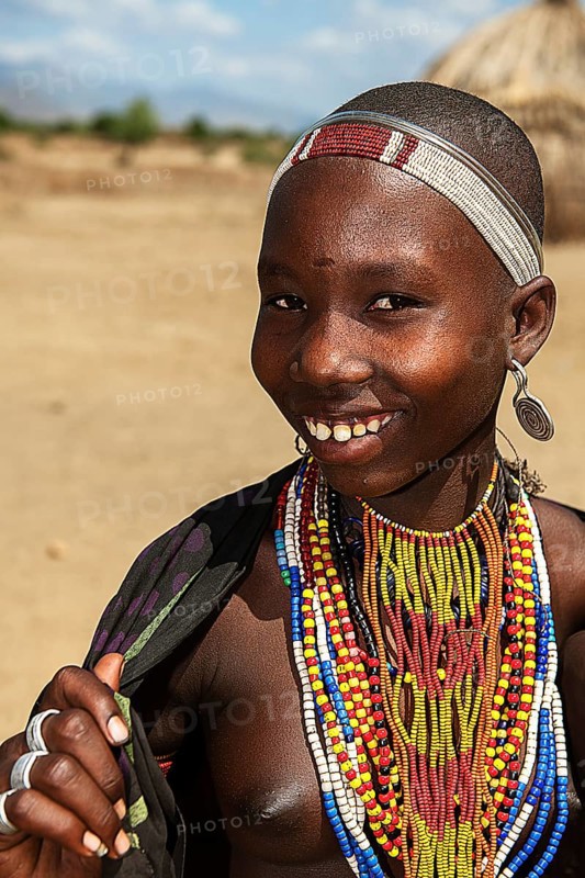 Laughing young woman with necklace