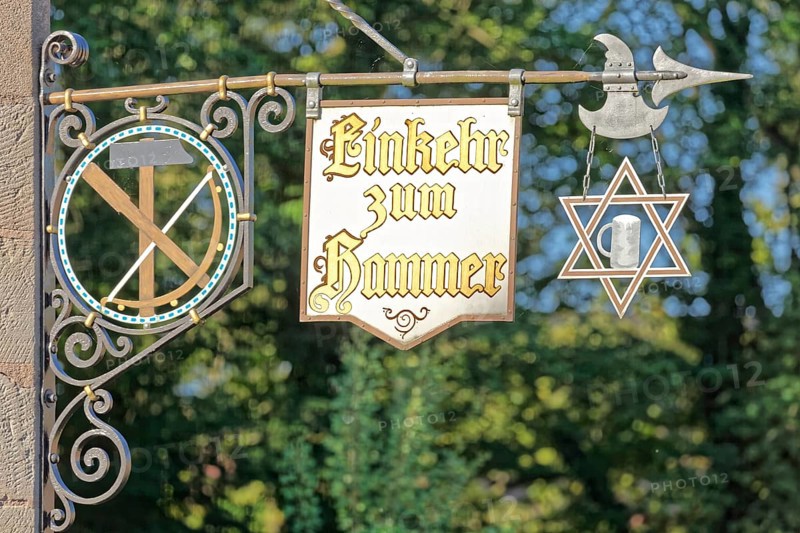 Signboards with inscription Contemplation to hammer Tavern