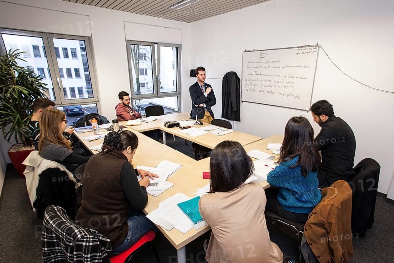 Foreigners in German lessons in an international class