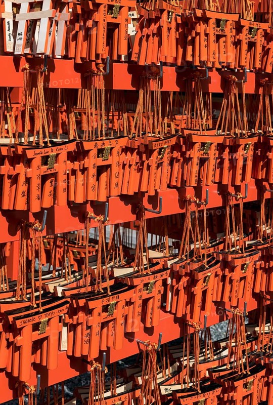Ema wish plaques in the shape of orange torii gate