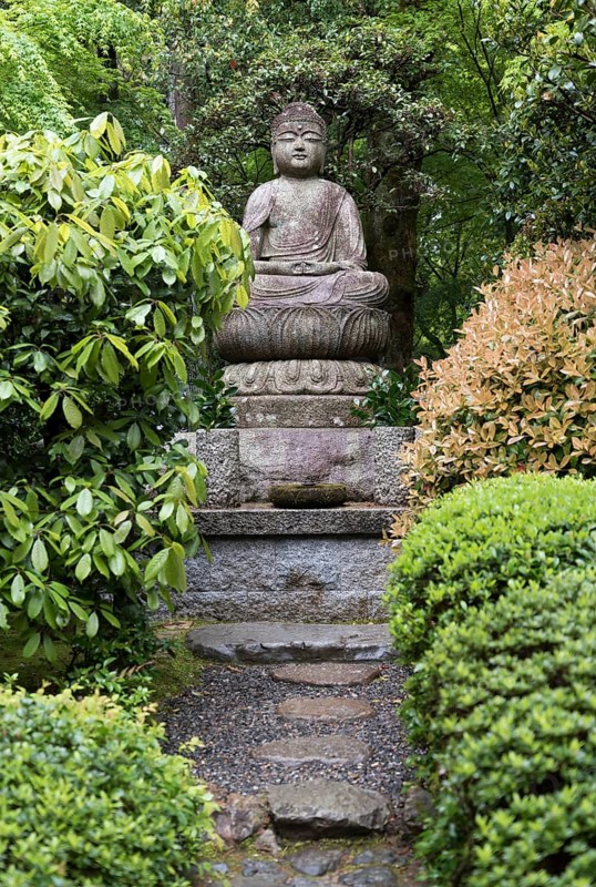 Buddha statue in garden of Ryoanji