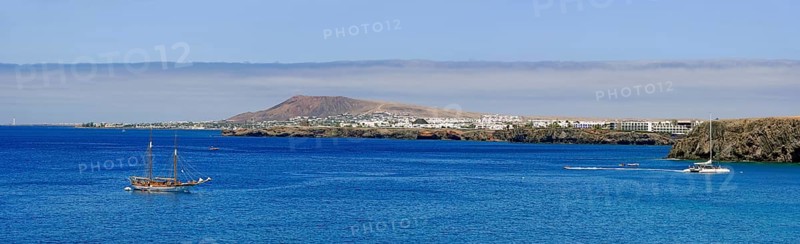 Beaches and Coast with sailing ship and Playa Blanca in the background
