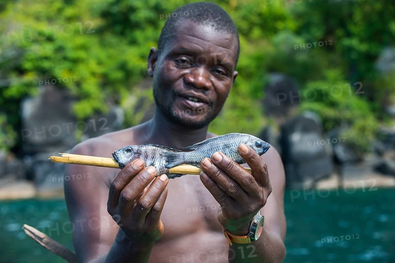 Local man holding fresh fishes
