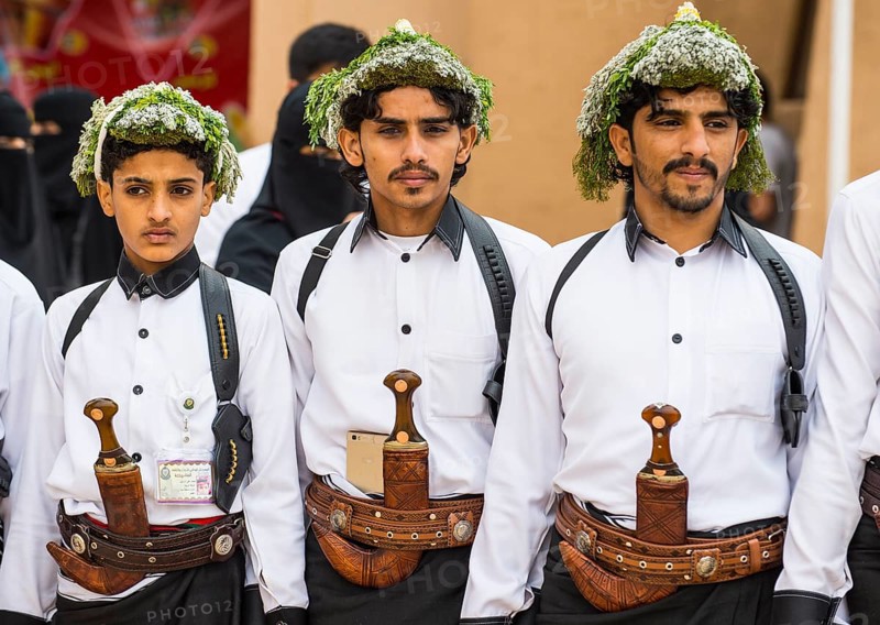 Traditional dressed men with with crooked dagger