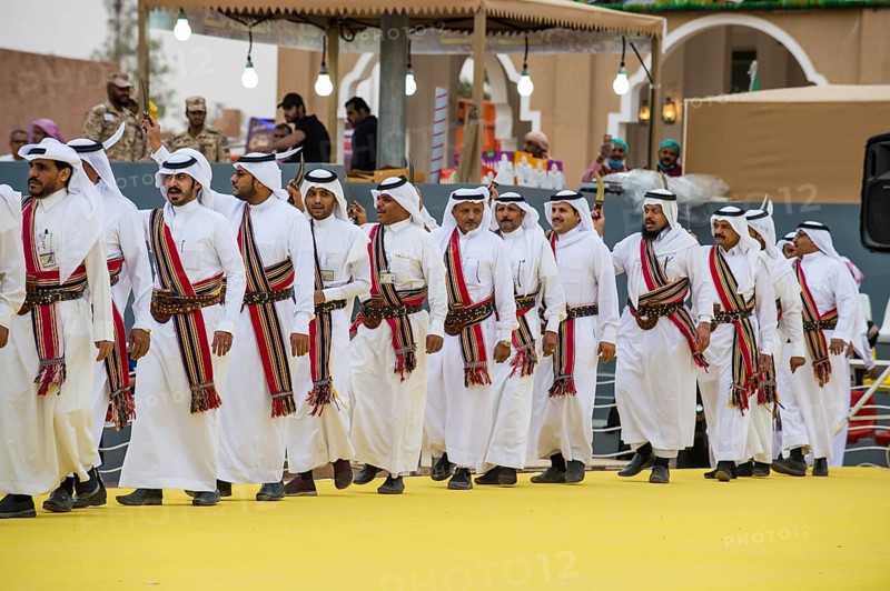 Traditional dressed local men dancing at the Al Janadriyah Festival