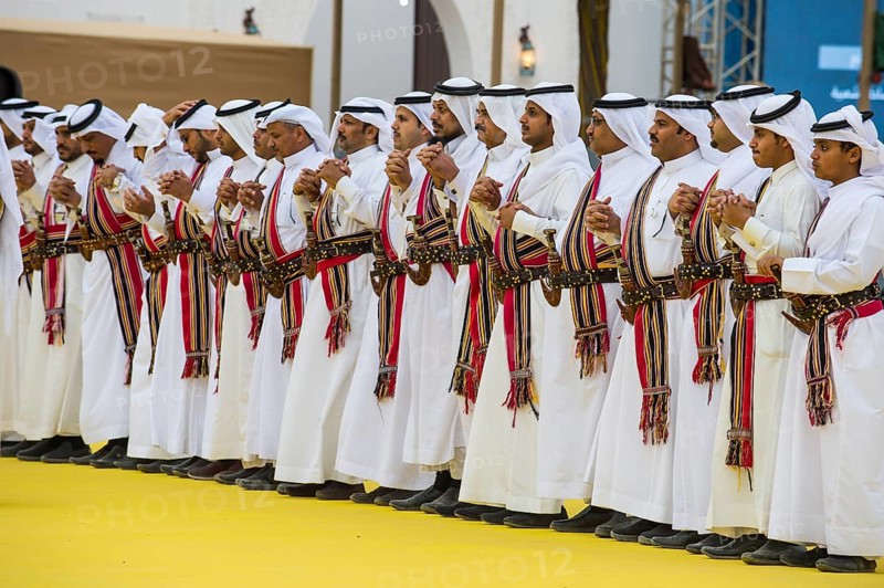 Traditional dressed local men dancing at the Al Janadriyah Festival