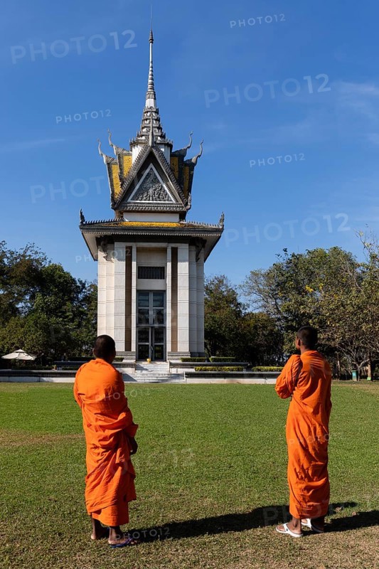 Buddhist monks in front of the Memorial Stupa
