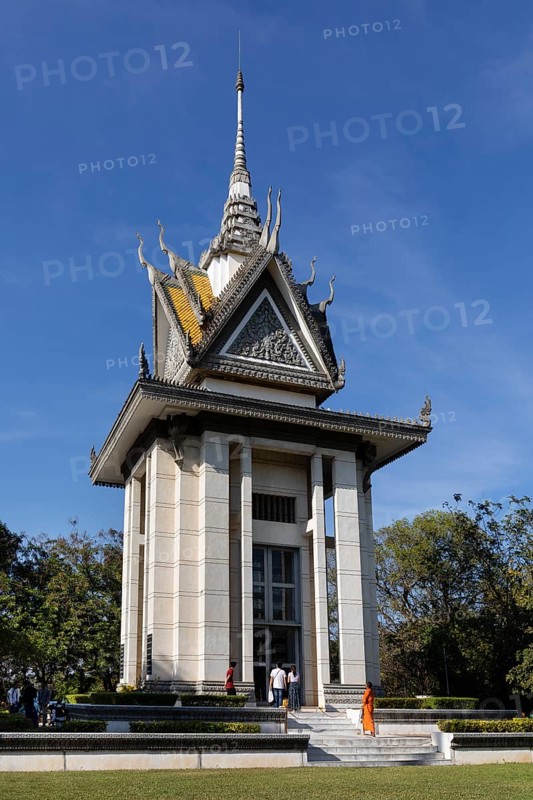 Buddhist monk in front of the Memorial Stupa