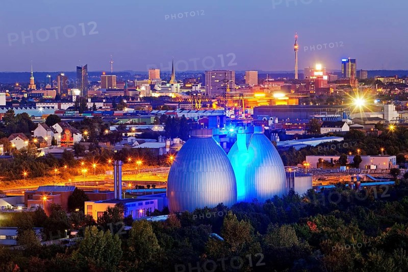 City view with the illuminated digesters of WWTP Dortmund Deusen II