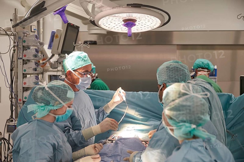Heart surgeon Prof. Richard Frey with team during a heart operation in the operating room