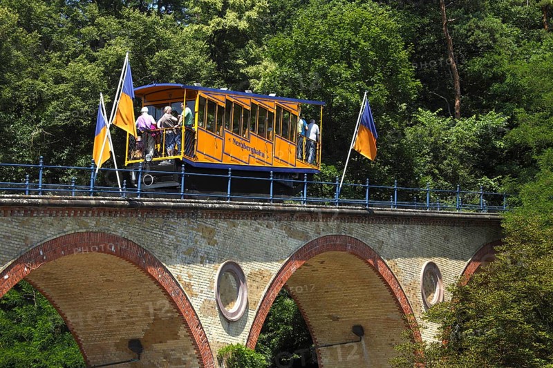 Waggon of Nerobergbahn drives over arch bridge