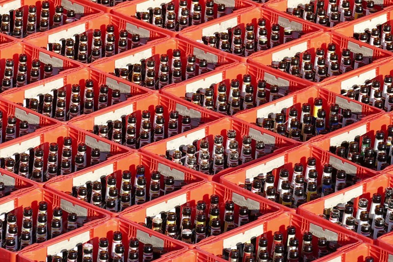 Red beer crates with empty beer bottles
