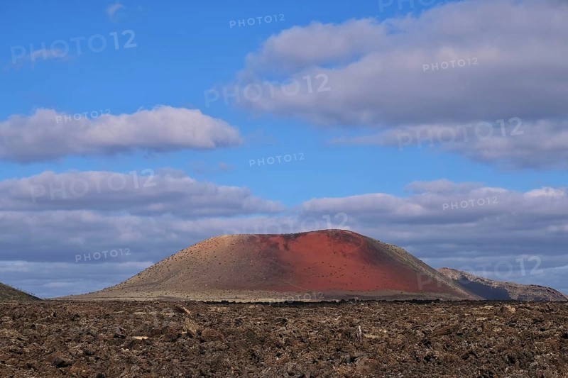 Lavafield Caldera Colorada with red volcano Pico Partido