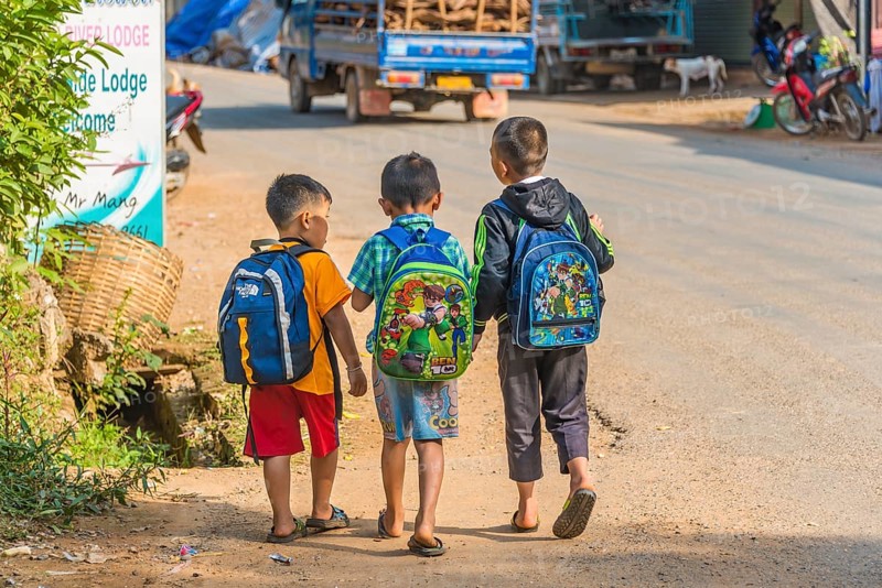 Three little boys going to school