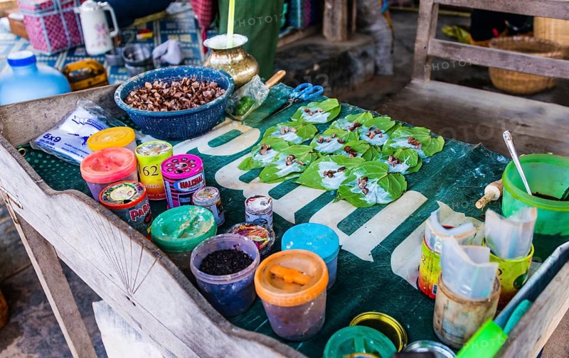 Market stall showing preparation of traditional chewing tobacco and betel nut