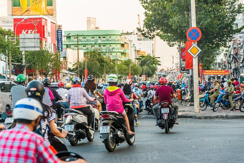 Scooter drivers in heavy traffic